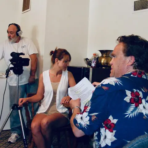 Director Jamison acting as Marcus Bryant while filming a scene with a lead actress in Bellevue Nebraska